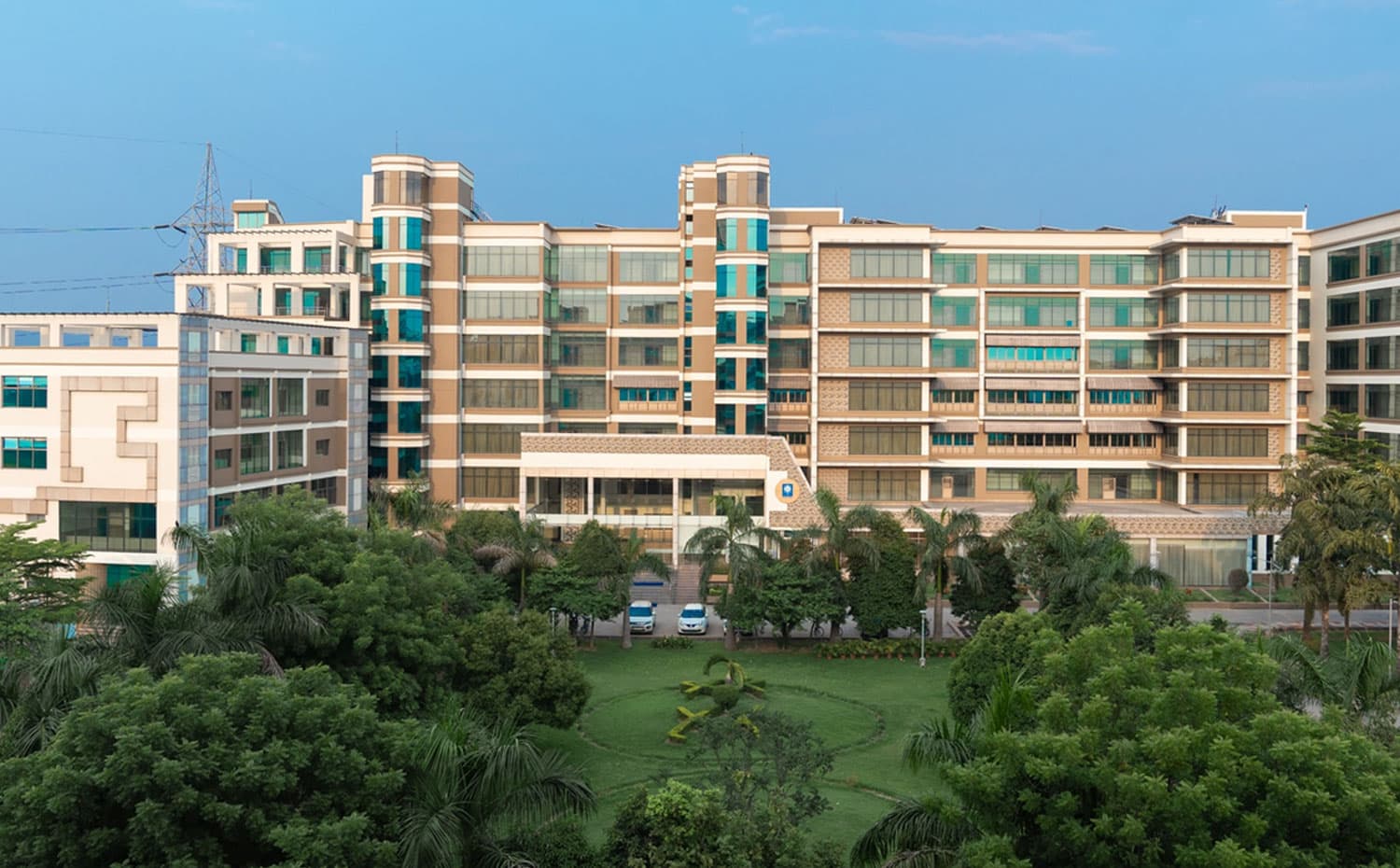 The XLRI Jamshedpur campus with a student cohort on the lawns